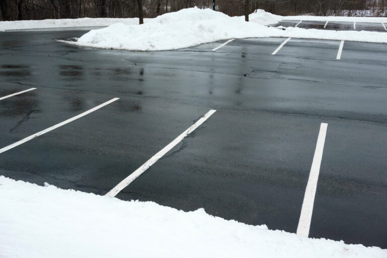 empty parking lot with snow removed empty parking lot with snow removed